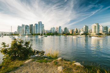 Fototapeta na wymiar Vancouver City Skyline and port during wonderful sunny day in Vancouver, BC, Canada