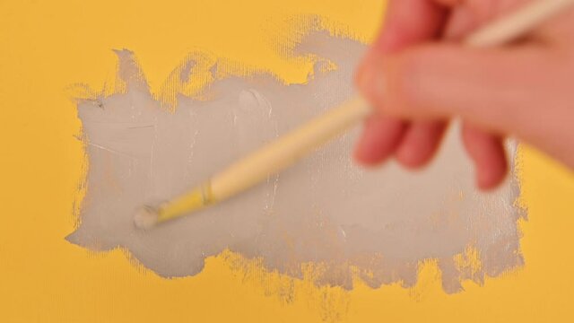 Abstract image with gray paints on a yellow background. Panton 2021 trend in yellow and gray colors. High quality 4k footage