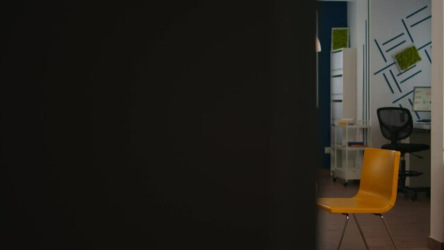 Interior of modern open plan office with no people, stylish room interior with table couch and chairs. Rest area in business center with small sofa, shot of empty room with modern furniture.