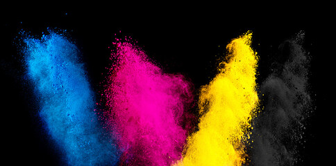 colorful CMYK cyan magenta yellow key holi paint color powder explosion isolated dark black...