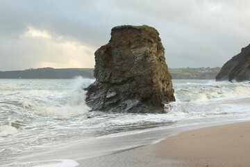 Fototapeta na wymiar Pillar of rock pummeled by storm waves from the Atlantic