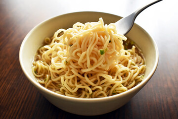 Instant noodles with a fork on a bowl.