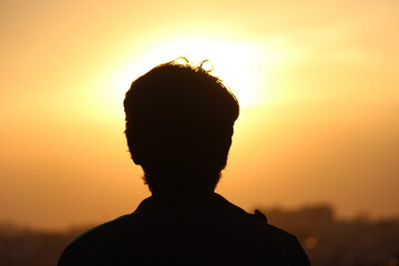 silhouette of a person in sunset