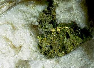 Pyrite crystal enclosed by barite, on a step of smoky quartz, from Germany, Harz Mountains, Oker