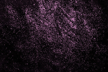 Black festive abstract background with pink confetti. Sparkling texture. Festive background for your projects.