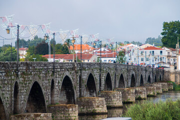 Fototapeta na wymiar Medieval bridge in the city of Ponte de Lima, Portugal.