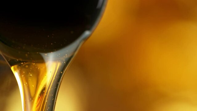 Super Slow Motion of Pouring Fresh New Motor Oil into Car's Engine. Filmed on High Speed Cinema Camera at 1000 fps.