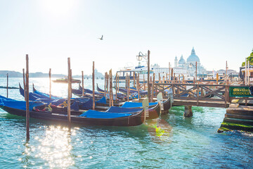 Fototapeta na wymiar VENICE, ITALY- December 21, 2017 : Tourists on Water street with Gondola in Venice, ITALY