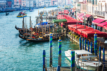 Fototapeta na wymiar VENICE, ITALY- December 21, 2017 : Tourists on Water street with Gondola in Venice, ITALY