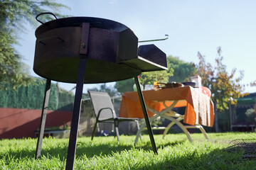 A low angle shot of a barbecue grill in a garden