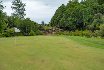 Lemuria Golf course hole nr. 5 green flag Resort Praslin Seychelles 