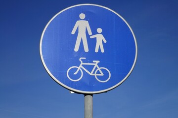 Road sign Pedestrian and Cyclist Path against the background of a blue sky