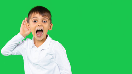 Body language, feelings, senses concept. Isolated view of a amazed boy in white shirt keeping hand...