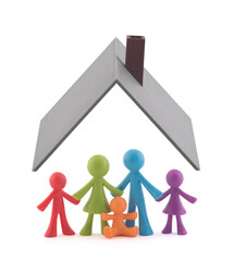 Colorful family figurines covered by house roof on white background