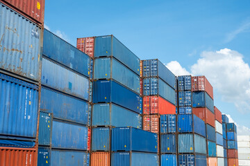 Containers box in shipyard factory with blue sky in background.