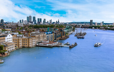 A view eastward down the River Thames from Tower Bridge, London, UK towards Canary Wharf  in the...