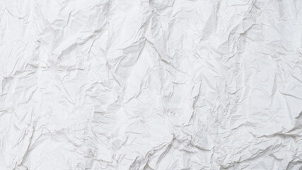 Crumpled white paper background.