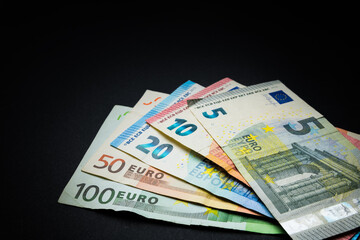 Abstract and conceptual of banknotes and money on black background.
