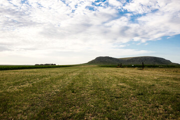 field, mountain and blue sky