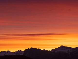 Burning sky over the Swiss Alps before sunrise 