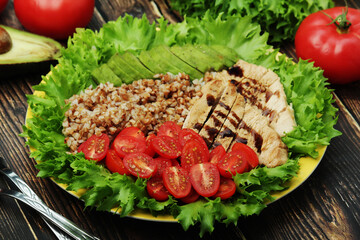 Turkey breast, avocado, salad and buckwheat as healthy lunch