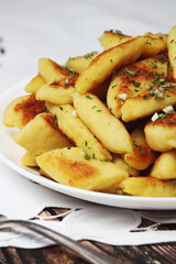 Polish dish kopytka served at the table