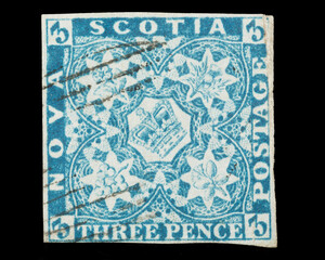 An 1853 three pence blue postage stamp from Nova Scotia, Canada, showing the emblems of the United...