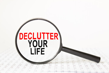 words DISCLAIMER in a magnifying glass on a white background. business concept