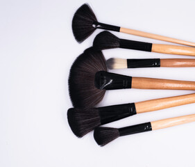 Head of Makeup brushes put on background,