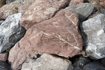 Red limestone rock on nature background.