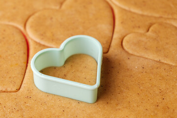 Homemade cookies for St. Valentines Day using green plastic baking mold. 