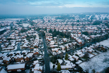 Snowfall and whiter fog over small English rural village in countryside, Cheshire UK. Christmas 2020. Early morning