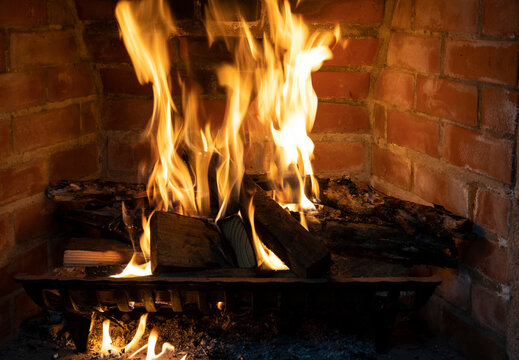 Close up view of a fireplace fire burning