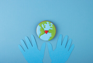 Thank you sign with paper hands in blue gloves on a medical background