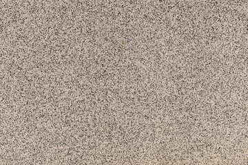 gray and black fine-grained surface as background or texture