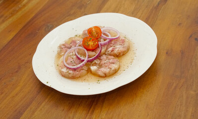 white collared pork with onion rings in vinegar an oil