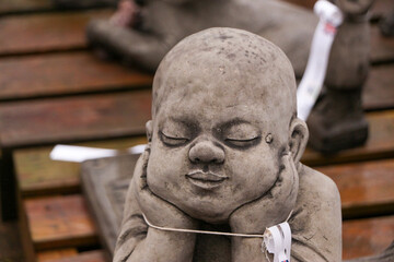 Statue of a baby at a garden centre