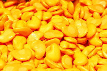 candy heart for Valentine's day. Candy A lot of sweets. Colorful texture using a background. Background rendering. Bright multiple jelly candies in powdered sugar. Confectionery wallpaper concept