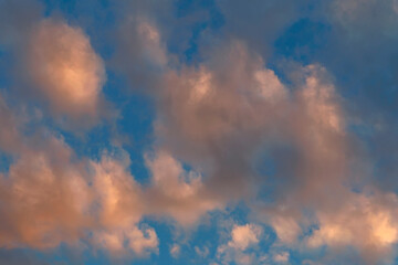 Beautiful sunlit golden clouds in the evening sky