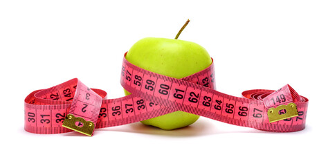 Fresh green apple with red measure tape isolated on white background. Diet food concept.
