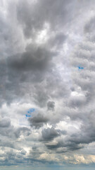 Fantastic soft thunderclouds, vertical panorama natural composition