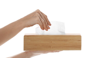 Woman taking paper tissue from holder on white background, closeup