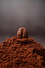 Closeup of coffee beans at the mixed heap of roasted coffee with copy space for text. Concept of...
