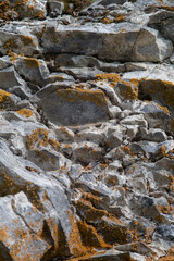 stones with orange moss. Rock texture