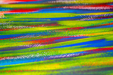 Background from different strokes of red, yellow, green and blue paint