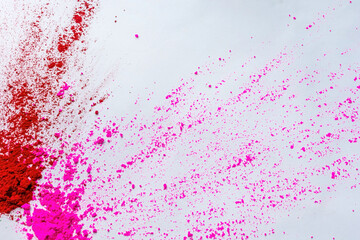 Fototapeta premium Happy Holi - gulal or holi powder splatter on white background.