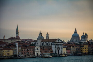 Fototapeta na wymiar A view of sunrise from the roof of Venice, with some famous churches, like the 