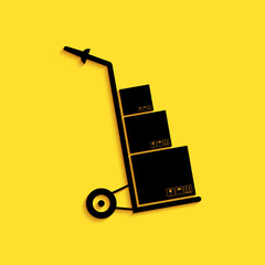 Black Hand truck and boxes icon isolated on yellow background. Dolly symbol. Long shadow style. Vector.