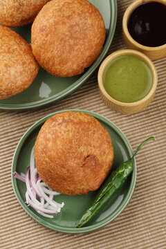 Indian teatime snack called Kachori or kachodi served with mint and tamarind dip or chutney. This is a popular in North and Central India