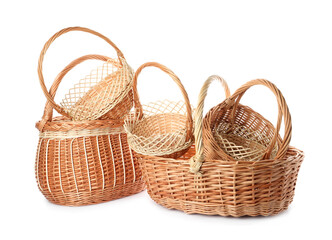 Many decorative wicker baskets on white background